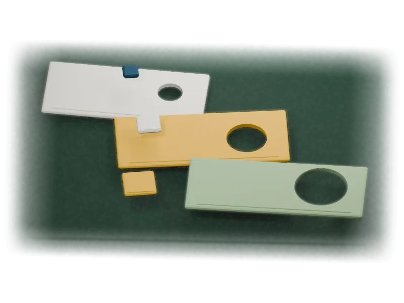 Cut-paper task shapes test progressively larger openings in folded cardstock gates.